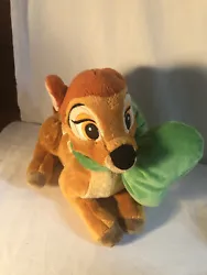 Plush Bambi stuffed animal with large green bow.