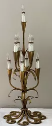 Approximately 13” wide 33” high Mid Century Modern Italian gilt iron and tile 9 light candelabra. Old and original....