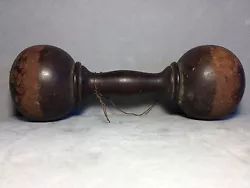 Up for sale is an Antique carved and lathed turned wooden dumbbell is as found estate condition. Wear on the dumbbell...