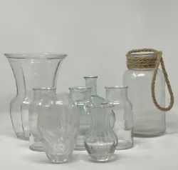 Add a touch of elegance to your home decor with this lot of 8 clear glass vases. Perfect for displaying your favorite...