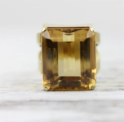 AMAZING HUGE 30+ CARAT NATURAL CITRINE RING. SOLID 14KT GOLD SETTING WITH A BRUSHED BACKED AND HALLMARKED ON THE...