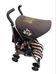 Experience luxury and style with the Juicy Couture Mclaren Stroller in a rare velour crown design perfect for your...