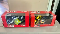 Up for auction are 2 packages containing 2 NASCAR 1:43 slot cars each.  Blue Plymouth #48, Yellow & Black Cd F Chimie...