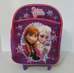 Purple multicolored bag features Elsa & Anna. Wheeled rolling bag. Front zip pocket. Retractable handle & top carry...