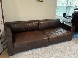For sale is an authentic restoration hardware sofa. None of the marks actually pierced the leather or even changed the...