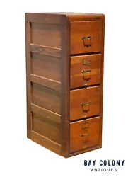 The cabinet retains most of its original hardware with the exception of a couple of file rods and a couple of index...