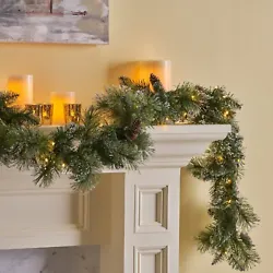 One (1) Artificial Christmas Garland. Fluff out the branches for your desired look and insert batteries to operate the...