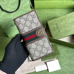 This sleek, slim wallet from the GG collection accentuates the classic design with tonal leather piping and an...