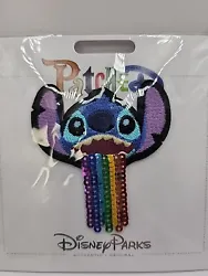 This Disney Parks Stitch patch is a colorful addition to any collection. Embroidered with rainbow colors and sequins,...