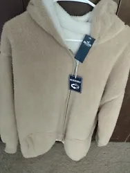 New With Tags: Womens Hollister sherpa style hoodie, reversible beige/white, size MEDIUM. Ships USPS.