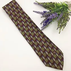 Maroon background with marching band hat print. Very good condition! Gucci silk necktie. Other colors include: green,...