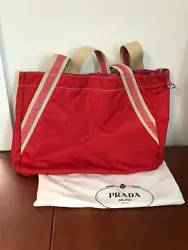 (2) This is a Prada Nylon Tote Bag. 1) This Prada Bag is pre-owned. It is in Good Condition. You are viewing aPrada...