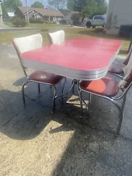 This vintage kitchen table and chairs set is a must-have for any kitchen enthusiast. The set includes a table and...