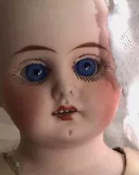 Pretty glass fixed eyes and leather body. Lace in photo is prop; not included.