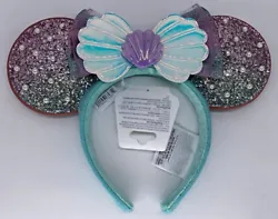 Minnie Mouse ear headband. Mouse Ears Headband. Disney Parks. Shell centerpiece with pearls. Over 100,000,000 served.