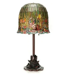 Inspired by lily pads, this intricate handmade lamp will add a unique glow to any room. The green, pink, and blue shade...