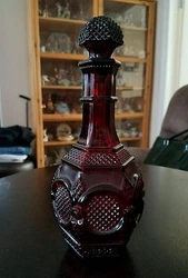 Very elegant looking vintage ruby red decanter By Avon , still in excellent condition I have more decanters and many...