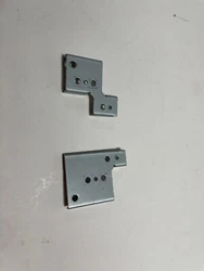 No part number, these go between the hinges and the bottom cover for strengthening the hinge connection points.