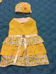 Bright yellow and white stripes and daisies make this a beautiful dress for spring walk in the park or that play date...