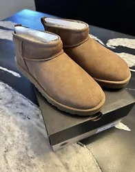 Elevate your fashion game with these authentic UGG Classic Ultra Mini boots. Made with premium suede material and lined...