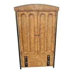 Mastercraft Burl Wood Brass trim wardrobe cabinet. Beautiful design with burl wood and four brass columns with faux...