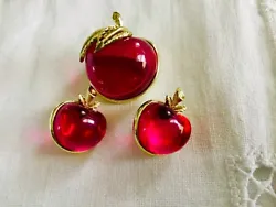 This pin and matching earrings are made in pink/red, almost magenta color. It is in excellent condition. The pin is...