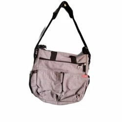 We added tote handles for versatility and an easy-access tech pocket. 14