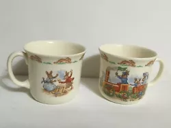 Two Bunnykins Cups ~ Royal Doulton. Great Condition.  Backstamp:  Tableware LTD 1936 on each.   Scenes include: ...