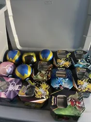 empty pokémon tins. Assorted lot of 13 EMPTY Pokémon tins. You receive all that’s in the pictures. 1 of the tins is...