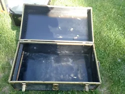 Trunk color is black. Had 2 leather handles.one on either side. Local pickup can be made available.