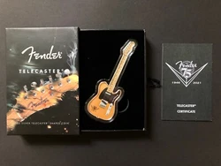 1 once dargent 75 ans de Fender.