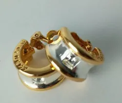 Givenchy Clip-on Earrings, Gold and Silver Tone, with a clear crystal stone inset in the upper middle of each earring....