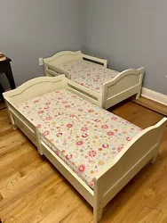 Sturdy and snug, white wooden Catalina Toddler Bed provides an easy transition between crib and big-kid bed. Outfitted...