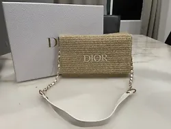 This Christian Dior DIORIVIERA Pouch Clutch Bag is a must-have for any fashionista. The unique rattan design with a...