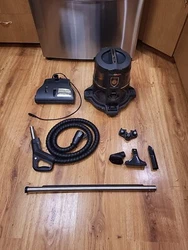 The HEPA filtered water/debris collection base. the electric brush powerhead.