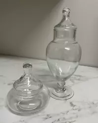 Set of 2 glass apothecary/vanity jars with lids. The short one is 5