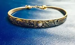 This bracelet is very beautiful! It is not marked sterling silver, but it is made of sterling silver. As you can see,...