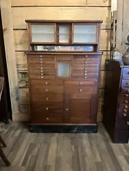 Up for sale is an exquisite antique early 20th century/late 19th century dental cabinet. This collectible piece is made...