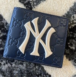 100% authenticBrand new Gucci mens Ny Yankees patch wallet in Navy color.Inclusions: dust bag (not...