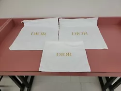 3 DIOR AUTHENTIC DUST BAGS WITH GOLD LOGO.DUST BAG LENGTH 17 INCHES WITDH 15.5 INCHES NEXT DUST BAG LENGTH 17 INCHES...