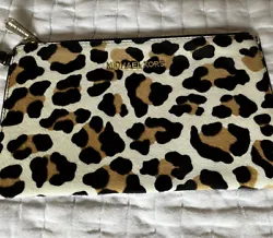 Michael Kors Leopard Wristlet. Feels like cowhide. Measures 10 inches wide and almost 6 inches tall