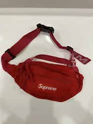 This Supreme waist bag is a stylish and functional accessory for men. It features an adjustable strap, making it easy...
