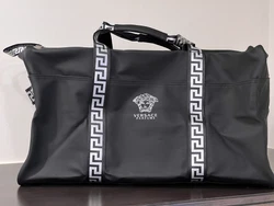 Limited edition VERSACE duffle bag. -Black color, faux leather body with silver color accents and black color lining...