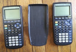 Lot of 2 TI-83 Plus Calculators (BROKEN FOR PARTS).