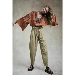 Designed in a high-rise, pleated silhouette, these so cool textured cotton pants are featured in an exaggerated...
