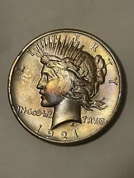 This exquisite 1921 High Relief Peace Silver Dollar is a prized possession for any collector. With a stunning design...
