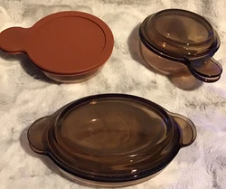 Vintage 3pc Pyrex Vision Ware Amber Oval V-14-B with lid heat N Serve V-150-PC with lidV-150-B with lidAll three dishes...