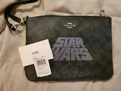 Coach Pouch Star Wars. New with tags. Nonsmoking home. Black signature leather.