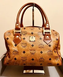 Authentic: MCM boston bag with original strapClean interiorPre-owned with signs of wear.Interior is clean no flaws or...