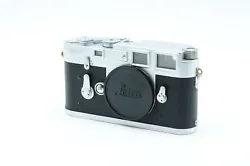 Dents in upper cover. Scratches/haze in viewfinder. Film advance is stiff. This item is rated inFair condition. Glass...